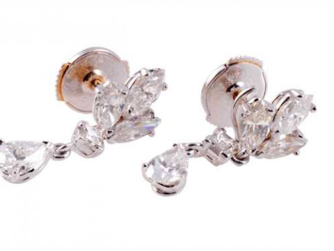 Cartier: A pair of diamond drop earrings, the pear cut diamond three claw...