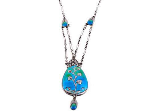 Murrle Bennett: An Art Nouveau silver and enamel necklace, the oval pendant...
