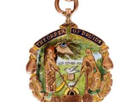 The Order of Druids: A 9 carat gold and enamel medallion, with presentation...