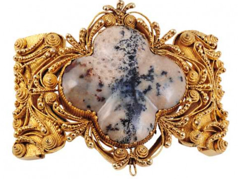 A hardstone brooch, circa 1800, the fancy cut moss agate collet set within...