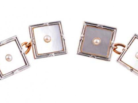 A pair of seed pearl, mother of pearl and platinum cufflinks, circa 1900,...