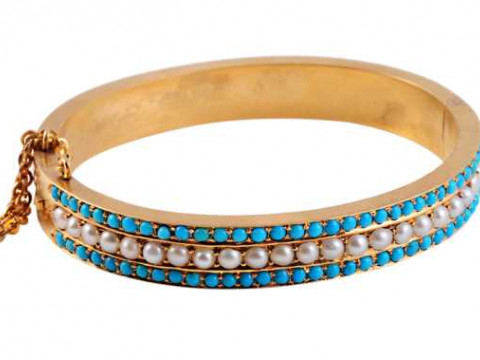 A Victorian pearl and turquoise bangle, circa 1880, the row of twenty...