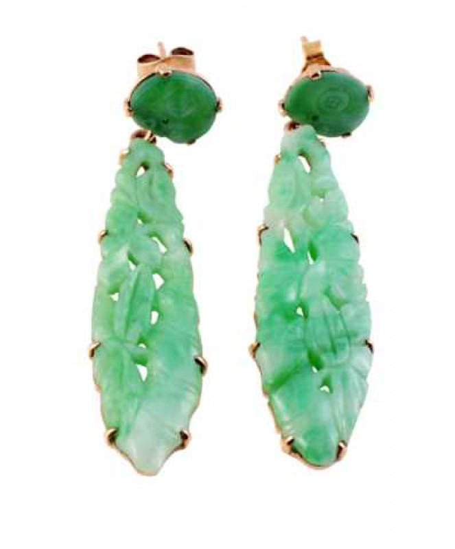 A pair of jade earrings, the carved and pierced oval shaped plaque eight claw set in an open mount suspending on an articulated link from a smaller oval plaque with subtle engraving on post and scroll fitting. In fitted box. Stamped 9ct. Accompanied by ce