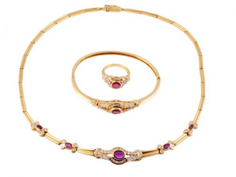 A diamond and ruby necklace, ring and bangle, the necklace of moulded...