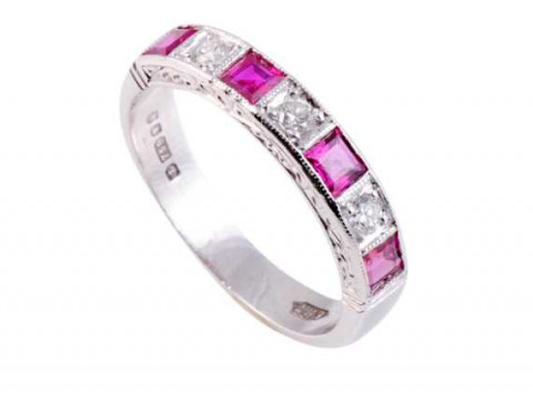 A ruby and diamond ring, the four square cut collet set rubies alternately...