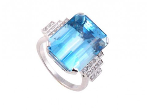 An aquamarine and diamond ring, the large rectangular cut aquamarine four...