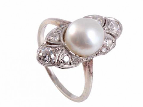 A natural pearl and diamond ring, the cultured pearl set to the centre...