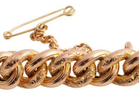 A Victorian brooch, designed as seven interlocking circles of alternate...