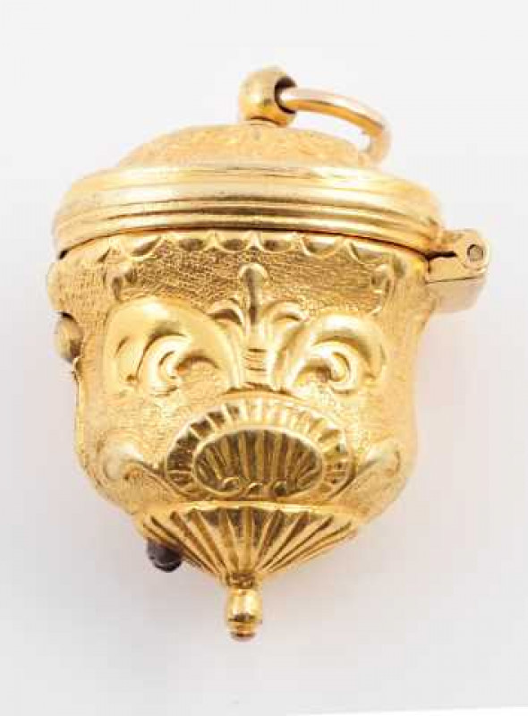 A pinchbeck snuff box, circa 1830, the oval shaped snuff box set throughout with textured and engraved detailing, the hinged lid to the bottom with a push button clasp, suspending from a simple bolt ring. Weight approx. 9.5gms.