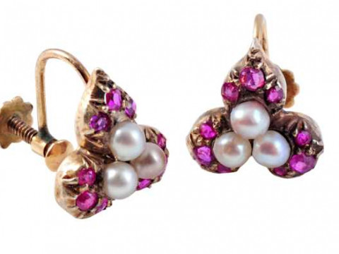 A pair of pearl and ruby earrings, the three natural pearls set as a cluster...