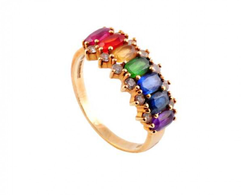 A diamond and multi precious stone ring, the seven oval cut eight claw set precious stones set to the centre of the mount in the order - amethyst, sapphire, tanzanite, emerald, yellow sapphire, fire opal and ruby, all representing the colours of the rainb