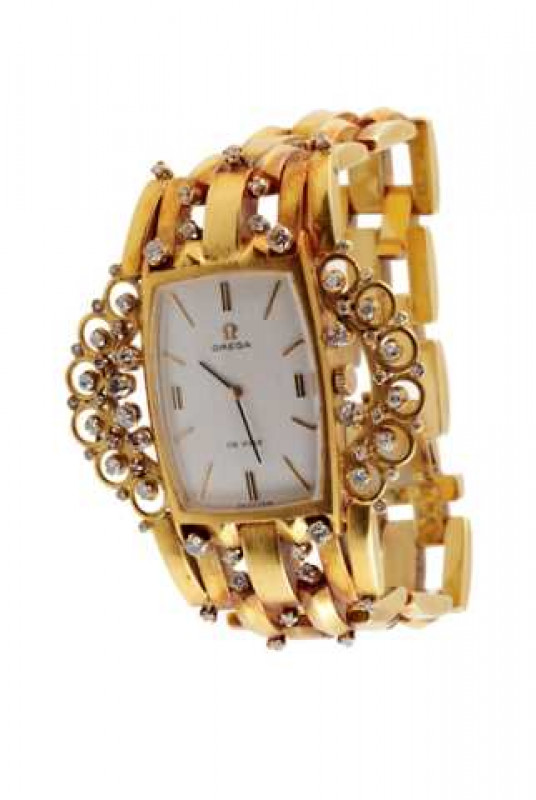 A converted diamond set bracelet watch, the rectangular dial, signed OMEGA DE VILLE, with baton numerals. Approximately 68 grams