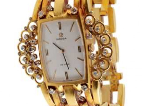 A converted diamond set bracelet watch, the rectangular dial, signed OMEGA...