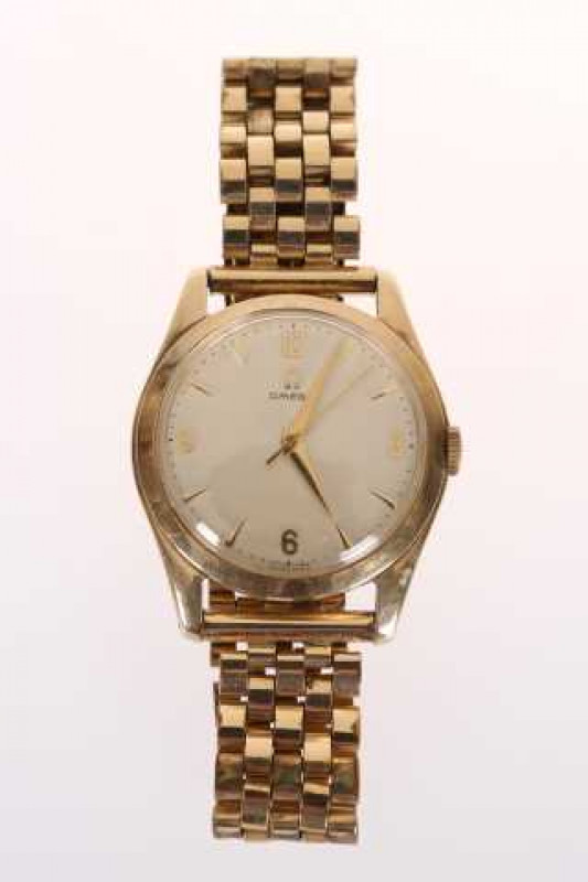 A gentleman's Omega yellow metal wristwatch, 30mm case, with centre sweep seconds, in an Omega box  with guarantee no. 14074512/621326, outer card case.