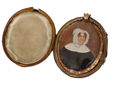 A fine double sided portrait miniature, in gilt metal frame (tests as...