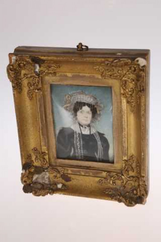 An early 19th Century portrait miniature of a lady, signed C.F. McKechney pinxt. Feb. 1829 (Deaf & Dumb) to verso, and with name and address of sitter, in the original gilt-composition frame, watercolour is  9cm by 6.5cms