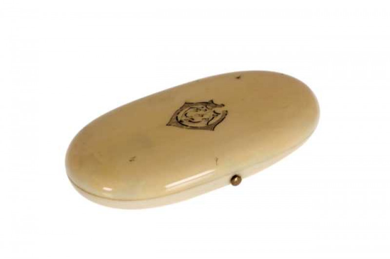 A French ivory etui, 19th Century, fitted with Palais Royale type gilt tools, the cover engraved with a monogram, (hinge a/f). 11cm by 5.5cm