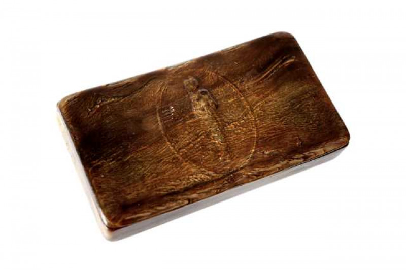 A 19th century pressed horn snuff box, the hinged cover centred by the figure of Napoleon within an oval cartouche. 8.5cm by 5cm