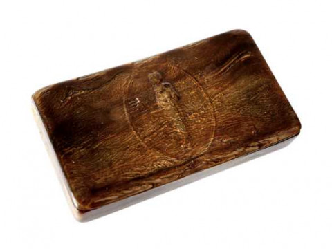 A 19th century pressed horn snuff box, the hinged cover centred by the...
