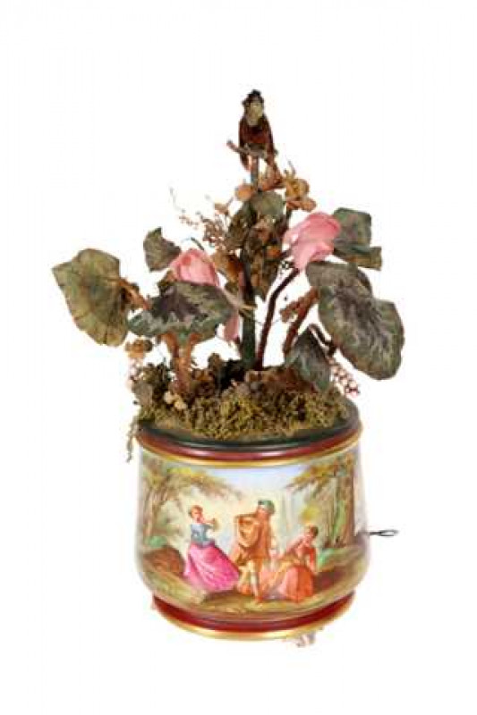 A 19th Century bird automaton, possibly by Blaise Bontems, circa 1880, a porcelain jardiniere, fitted with Begonia and other artificial flowers, surmounted by a feather bird automaton, 49cms high.