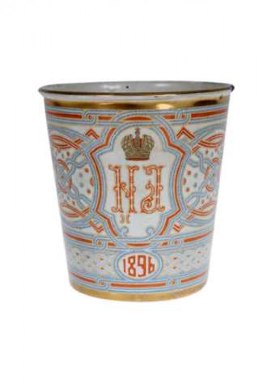 A Russian enamel Khodynka cup (also known as 'The Cup of Sorrows'), produced for the Coronation of Tsar Nicholas II, 1896.  Note: The beaker is one of many that were distributed at the Coronation. On the morning of 18 May 1896, over 1,000 people were tram
