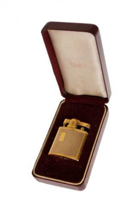 A Ronson 9 carat gold lighter, with engine turned panels, in a Ronson fitted box.