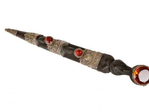 A Scottish leather, wood and steel dirk, mounted with cairngorms. 46cm