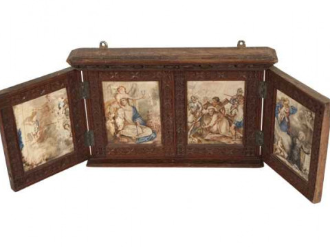 A carved oak tabernacle, the twin hinged doors opening to reveal four...