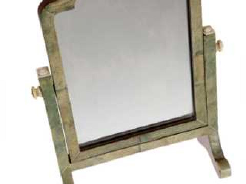 A shagreen and ivory on walnut, miniature dressing mirror, circa 1925,...