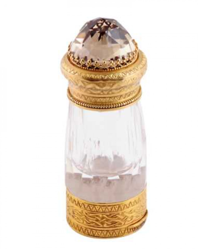 A fine 19th Century yellow metal and glass vinaigrette and scent flask, with 'jewel' inset crown top above a faceted body with hinged and crest engraved base, enclosing hinged grille. 8cm