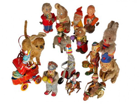 A collection of vintage toys, the vast majority clockwork.