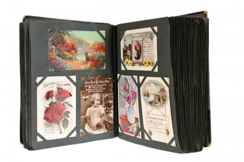 An album of approximately 450 postcards, predominantly early 20th century, various subjects.