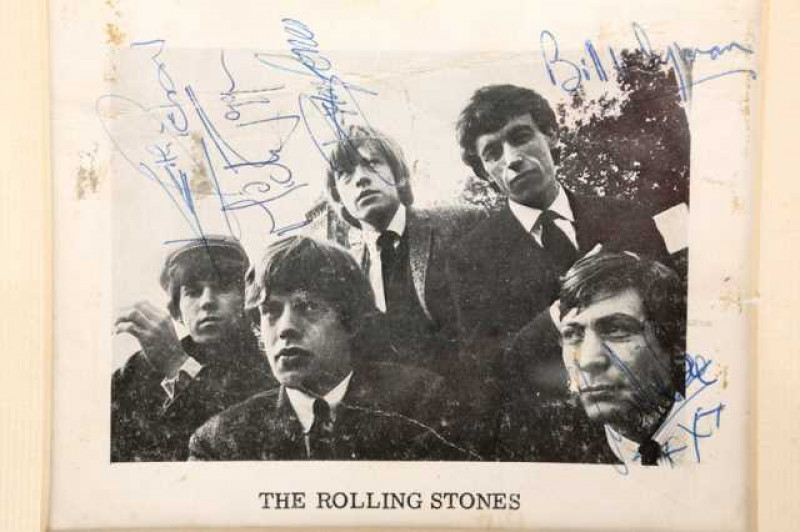 The Rolling Stones, publicity card, signed by all five members of the group.  Note: Obtained at a party held by Mick in Richmond, which the vendor was invited to by Brian Jones.