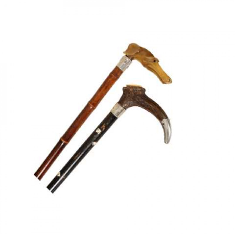 A horn handled walking stick, the handle carved as the head of a greyhound; together with another horn handled walking stick, inlaid with dice. (2) First 86.5cm