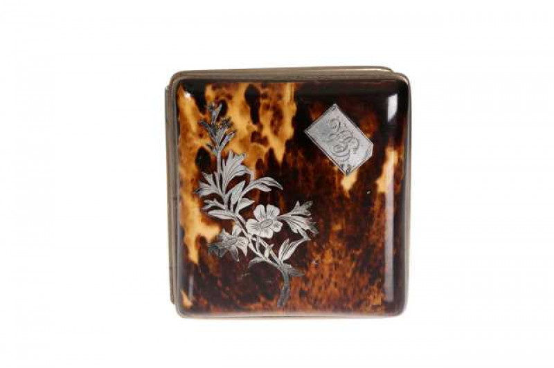 A Victorian tortoiseshell purse, the cover inlaid with a floral spray and a monogrammed plaque. 8.5cm by 8.5cm