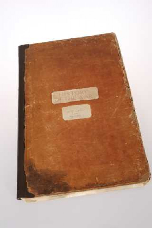 History of the War, a scrapbook, the cover with applied paper cutting bearing the signature H.G. Wells and dated 1914-1918.