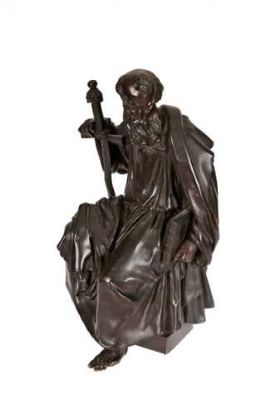 A 19th century bronze figure of St. Peter, cast sitting with a flame bladed sword in his right hand and a book under his left arm, probably French, stamped no. 3038. 43cm