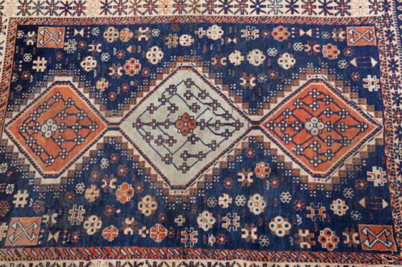 An Antique Caucasian rug. 127cm by 107cm