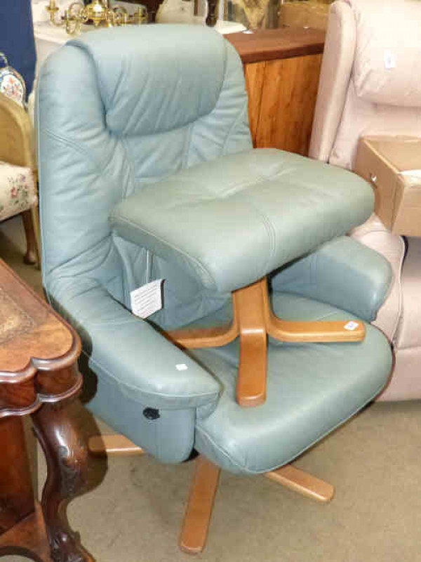 Pale green leather swivel easy chair and footstool