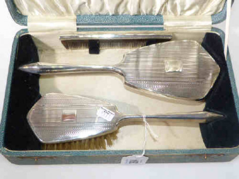 Cased three-piece silver brush and mirror set, Birmingham 1939