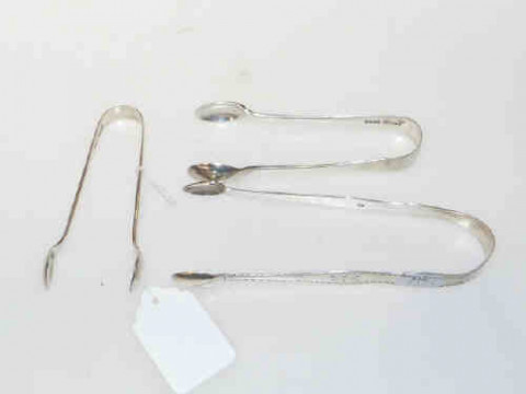 Georgian silver bright cut tongs and two other pairs (3)