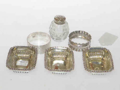 Three silver open salts, two napkin rings and glass pepper (6)