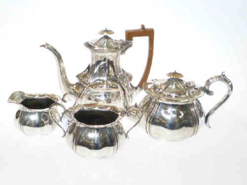 Silver plate three piece tea set and coffee pot