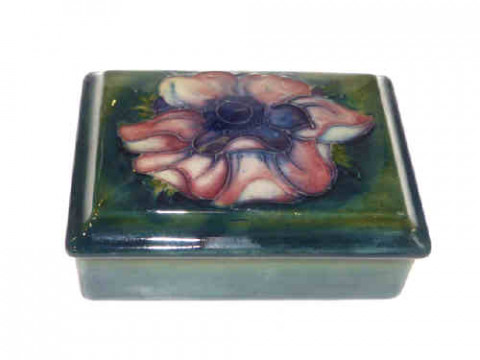 Moorcroft anemone lidded box, shaded green ground, impressed signature...