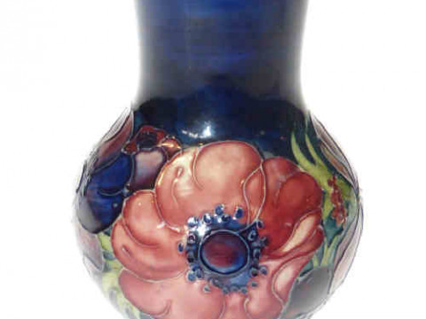 Moorcroft anemone vase, dark blue ground, 13cm