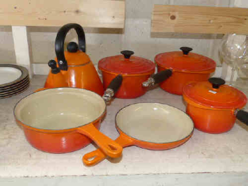 Five Le Creuset pans and kettle