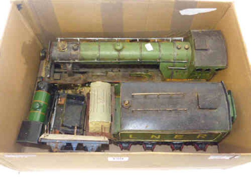 Model tinplate train and tender, clockwork train and wagons