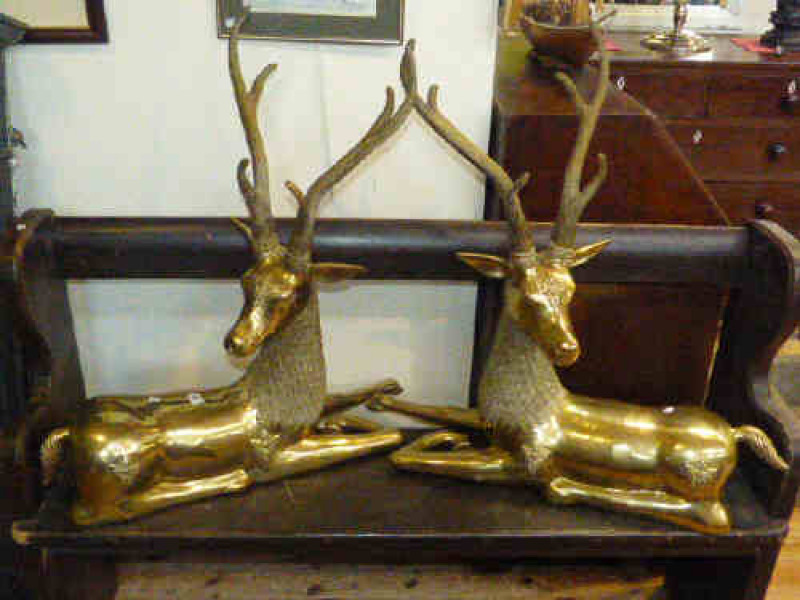 Pair of large brass recumbent models of stags