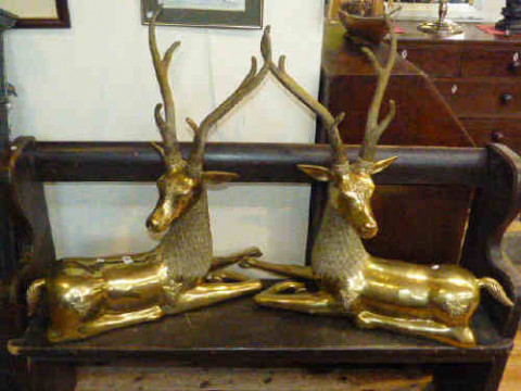 Pair of large brass recumbent models of stags