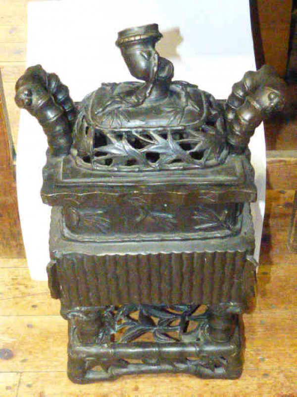 Oriental bronze censer with ornate pierced cover on four feet to ornate base